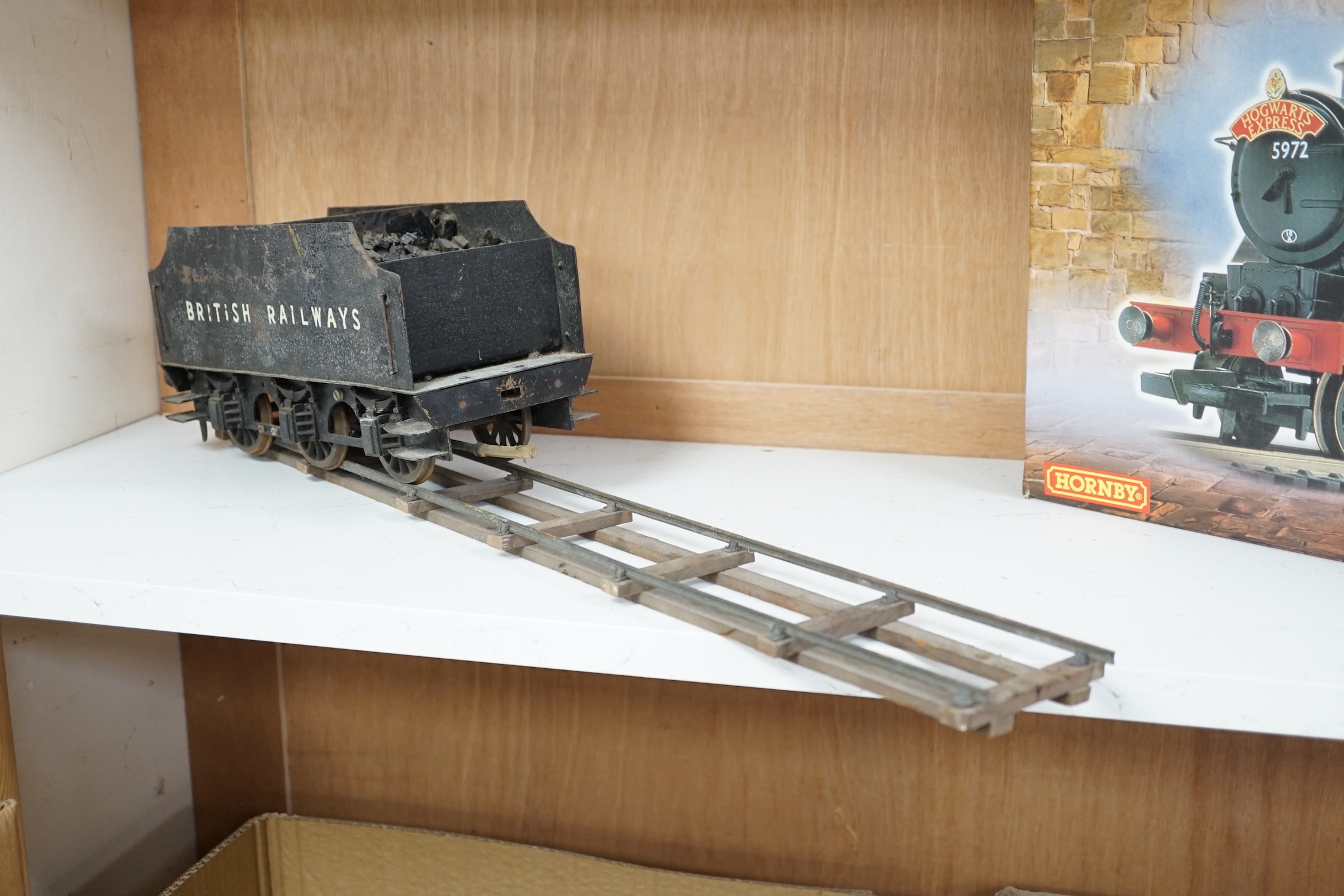 A paraffin/meths fired 2.5 inch live steam BR class 4F 0-6-0 tender locomotive, single inside cylinder, six wick burner, safety valve and whistle under running board, 72cm long over the buffers